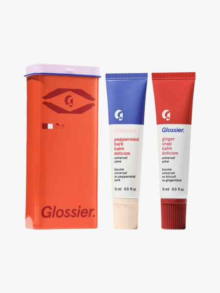 Glossier Sugar + Spice Balm Dotcom Lip Balm Duo Makeup Gift Set in branded components on a light gray background